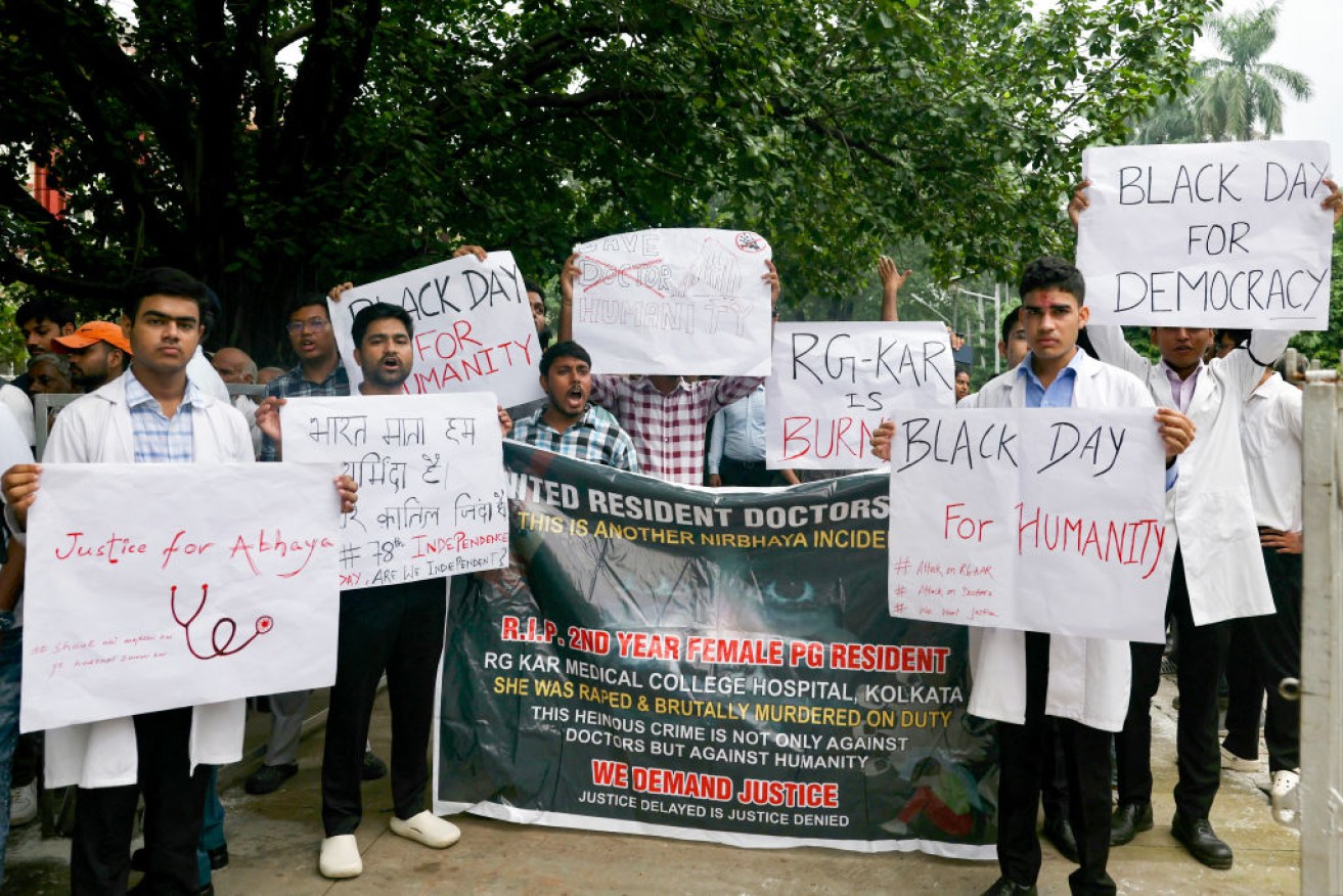 Medical students shout slogans and hold posters as they protest the rape and murder of a young medic from Kolkata. Indian doctors in government hospitals across several states halted elective services "indefinitely" on August 12 in protest against the doctor's rape and murder.