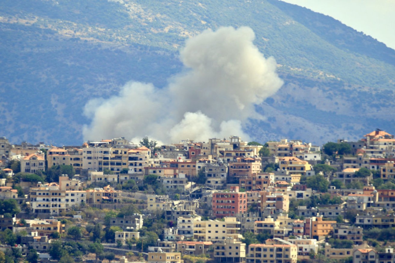 Smoke billows from the site of an Israeli airstrike in the southern Lebanese village of Khiam.