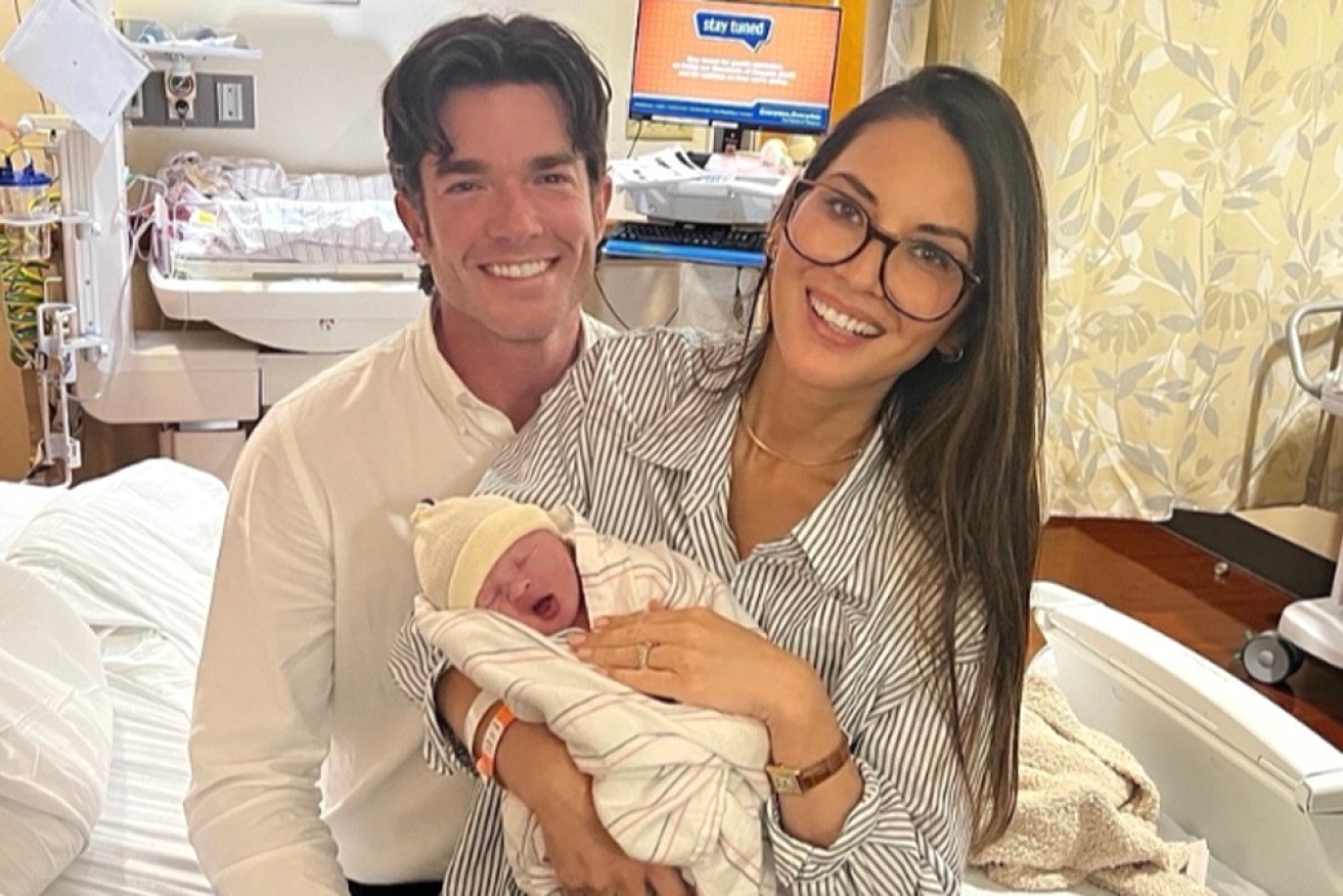 Munn and Mulaney with newborn daughter Méi.