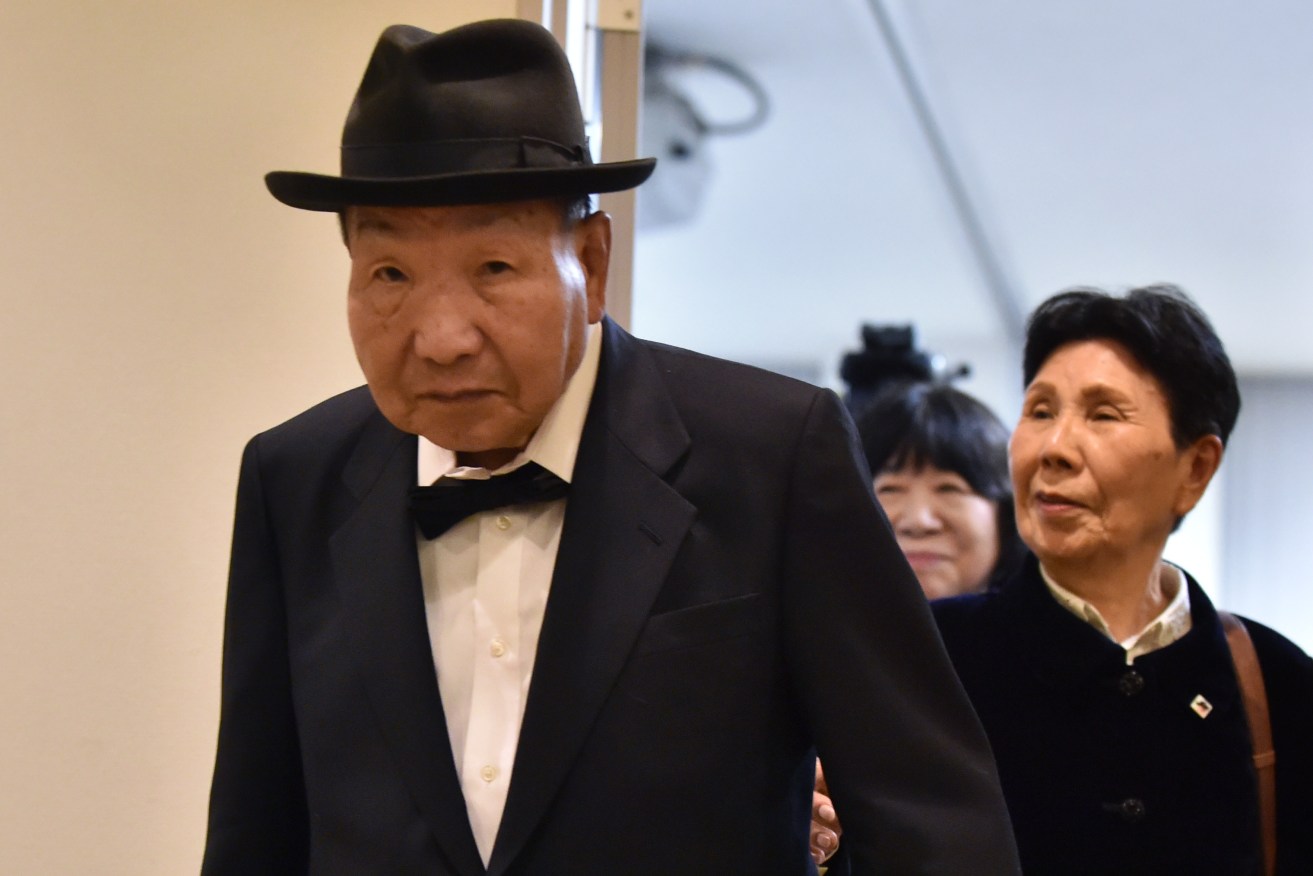 Iwao Hakamada, seen with his sister Hideko, has been found not guilty of murder after spending decades in prison on death row.