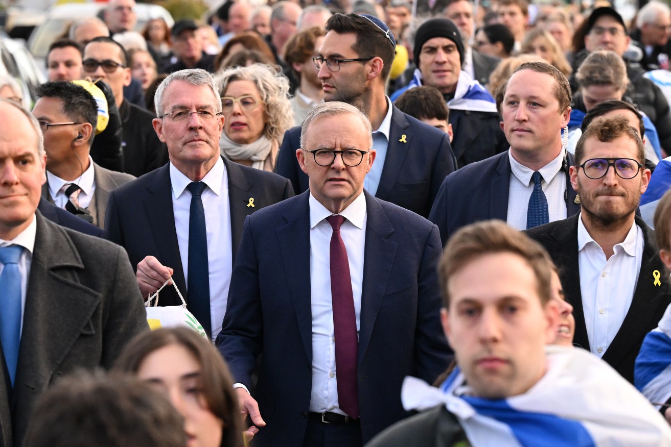 Prime Minister Anthony Albanese stands with the Jewish community at a vigil in Melbourne on Monday.