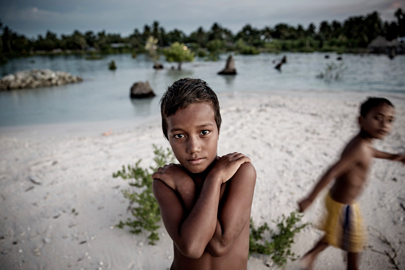 By the end of the century, depending on the intensity of global warming, Kiribati's sea level could rise by as much as a metre.