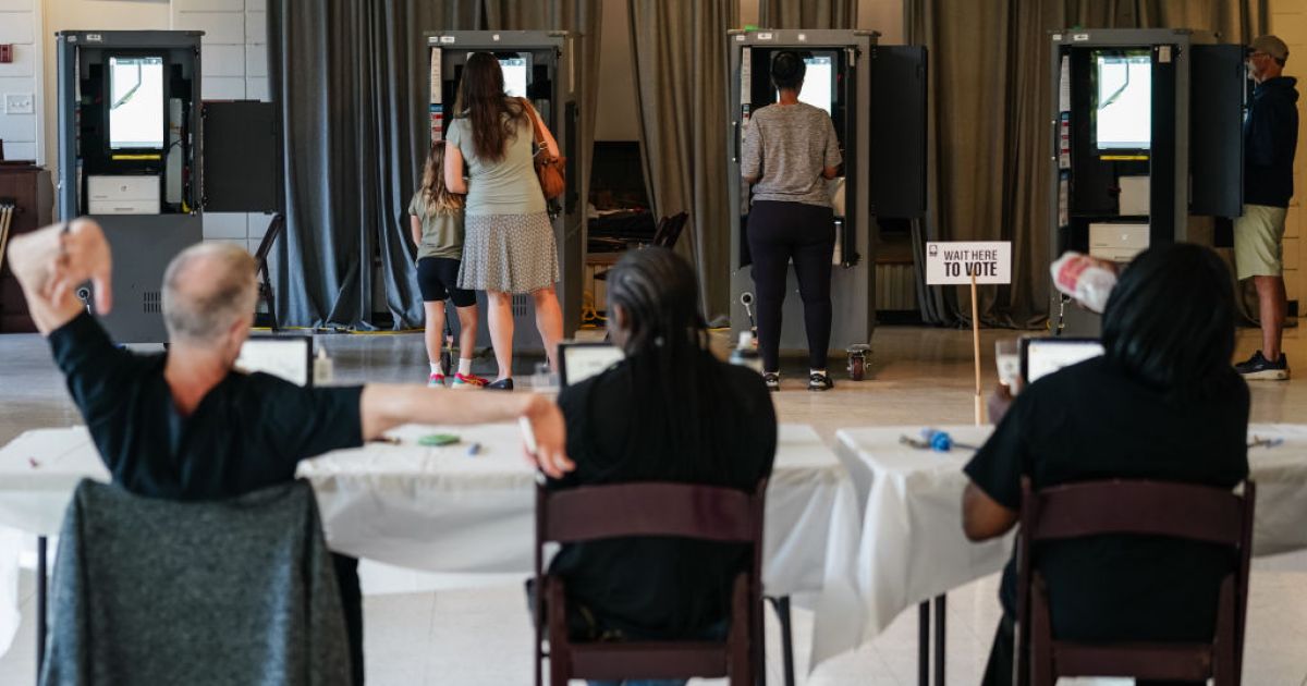 fends off interference in election as voters flock to the polls