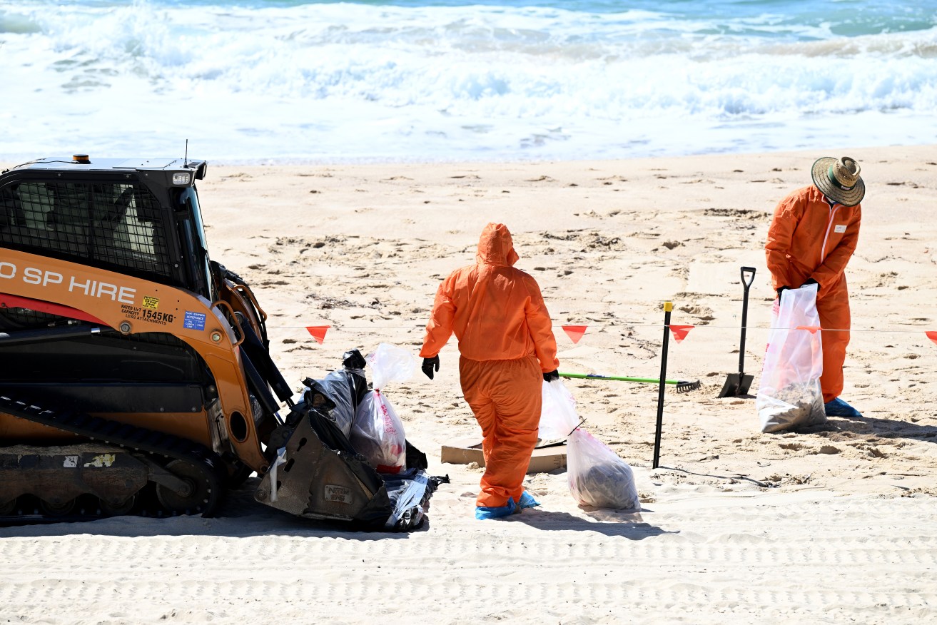 Workers spent most of the week cleaning several beaches of tar balls that washed up in waves.