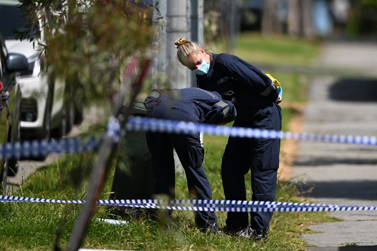 Forensic investigators at the crime scene in South Morang.