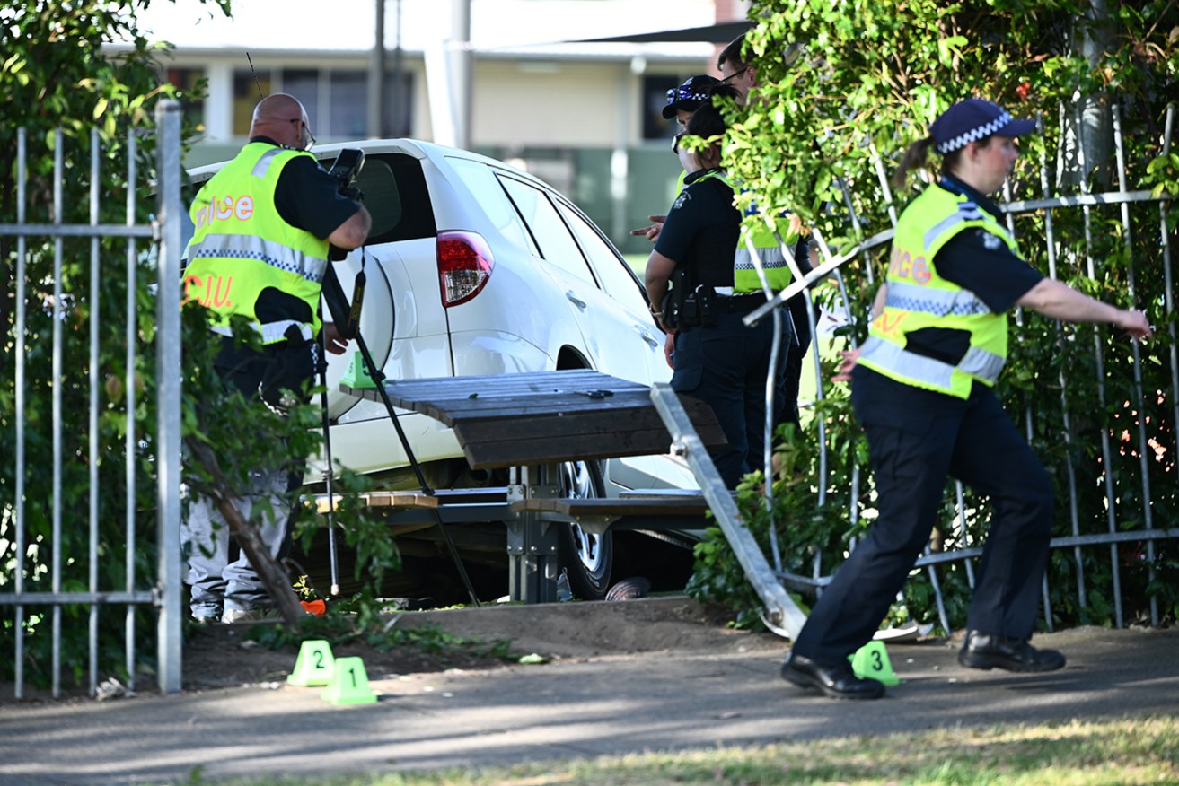 Police examine the accident scene at Auburn South Primary School in Hawthorn East on Tuesday.