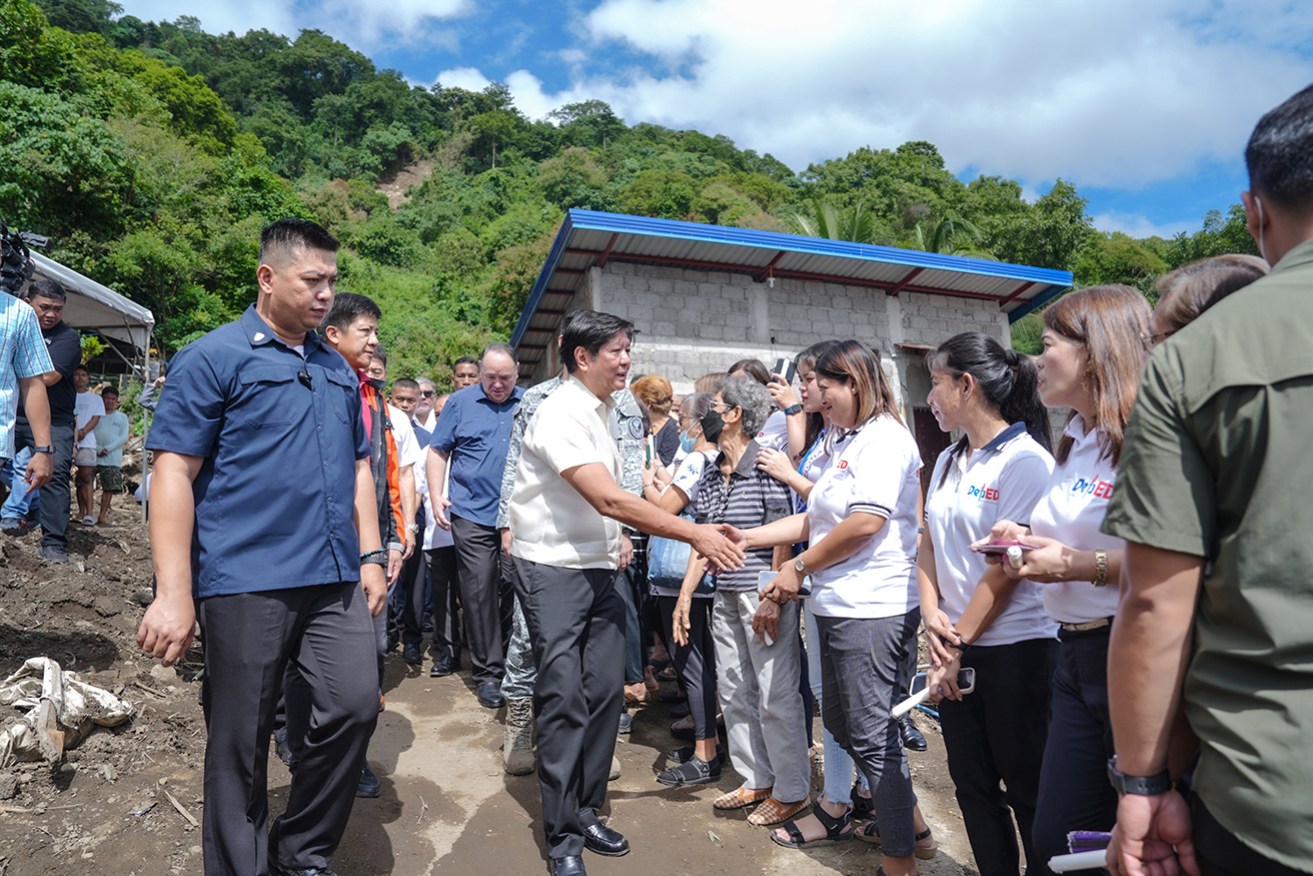 Philippine president Ferdinand Marcos Jr visits a village affected by Tropical Storm Trami.