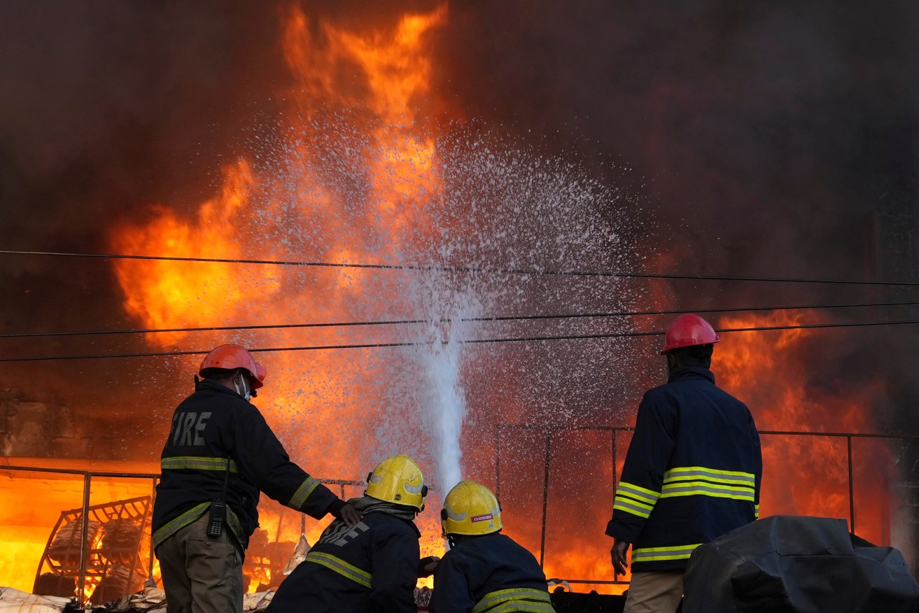 A hospital ward in Uttar Pradesh state was well ablaze when firefighters arrived.