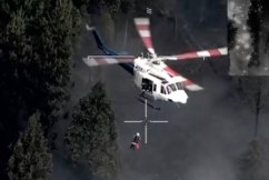 Dramatic bushfire rescue as woman waves towel