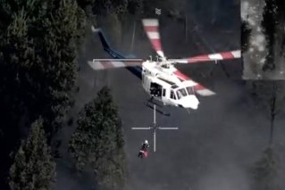 Dramatic bushfire rescue as woman waves towel
