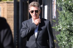 Designer Wayne Cooper to fight charge of wife assault