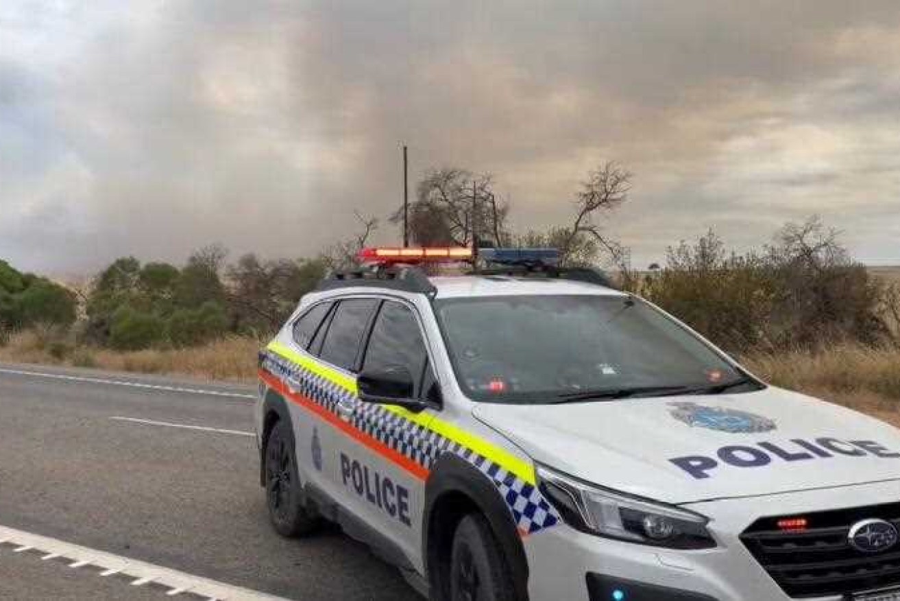 Road closures have disrupted travel in Western Australia as crews battle an out-of-control bushfire.