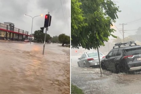 Driver rescued as flash flooding swamps town 