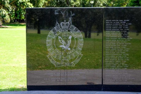 Man charged over vandalism of police tributes memorial