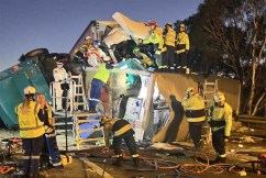 One dead, another trapped in truck crash carnage
