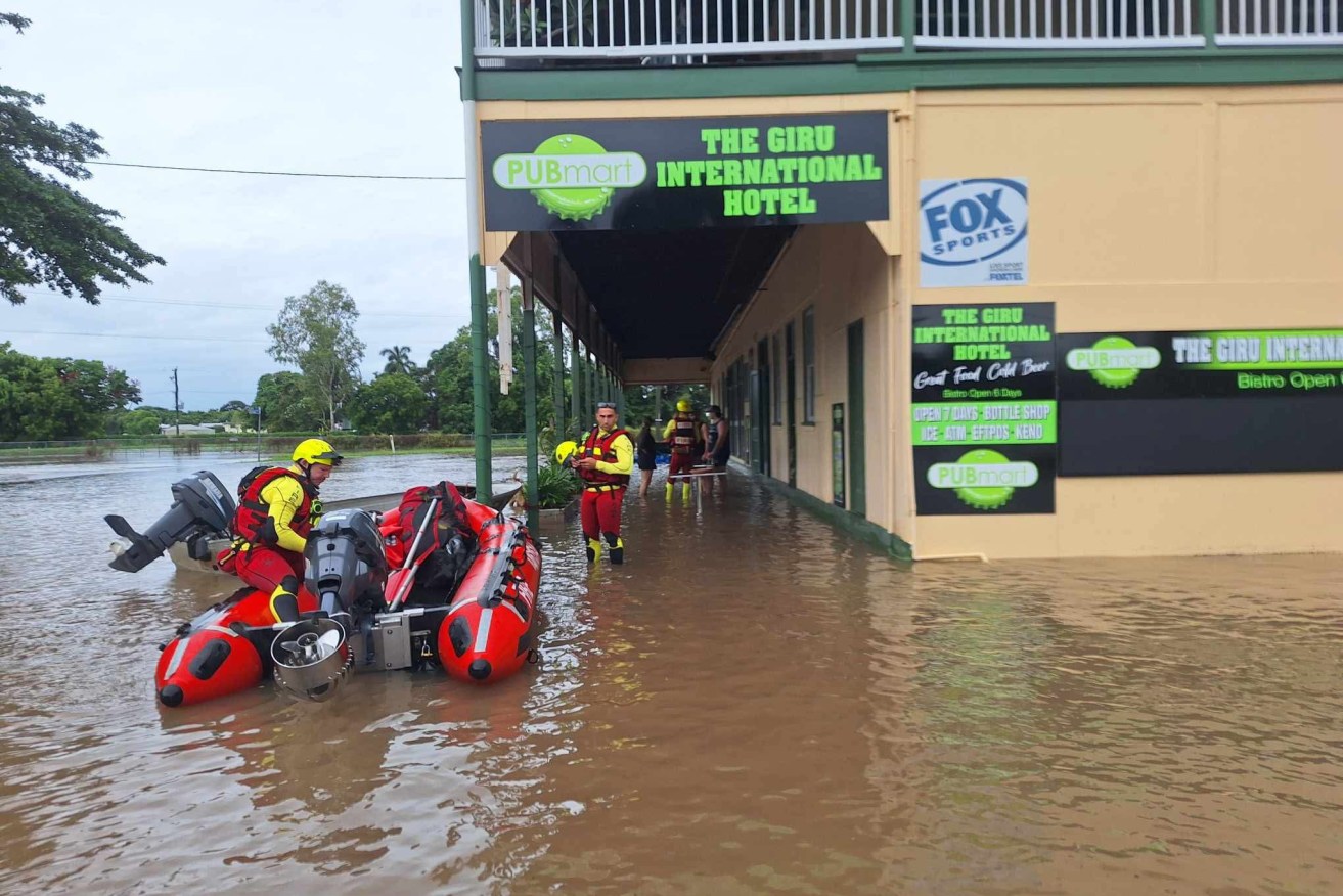 Cyclone watch, deadly disease alert for flood-stricken north Queensland