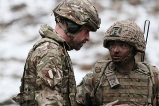 William in battle gear on visit near Russian border