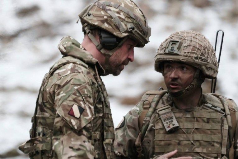 William in battle gear on visit near Russian border