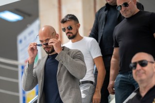 Tate heads to Romania to meet legal obligations