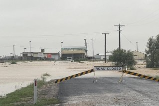 Homes inundated as floods engulf Qld town