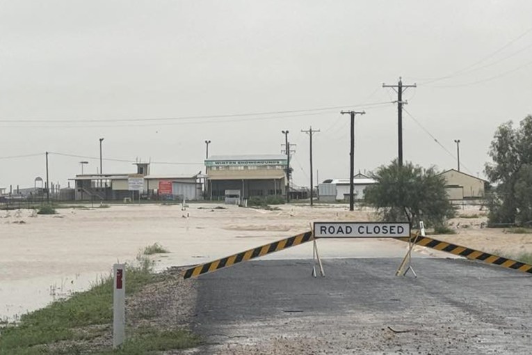 Homes inundated as floods engulf Qld town