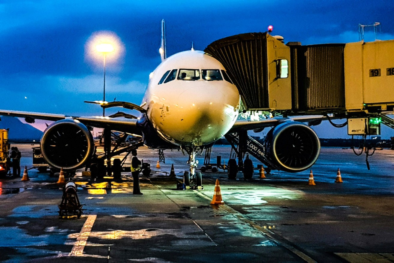 Refuelling an airplane at the airport.