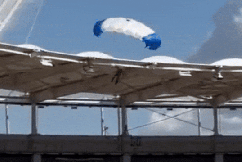 Bungled entry leaves parachuter dangling