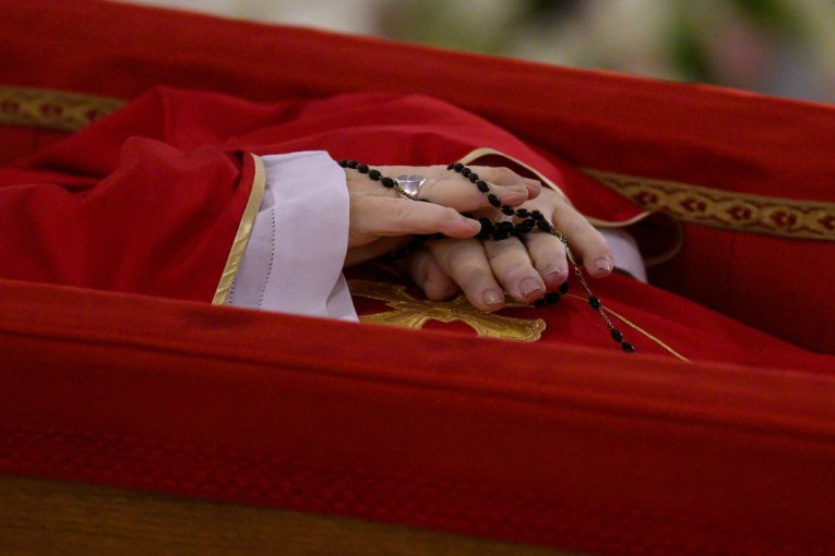Vatican shares first photos of Pope in coffin 