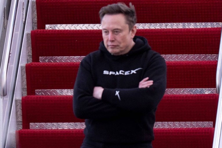Musk to spend more time with Tesla as profits dive