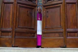Black smoke rises over Vatican in secretive vote