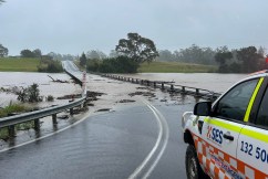 Residents airlifted off roofs in record NSW floods
