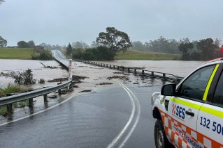 Residents airlifted off roofs in record NSW floods