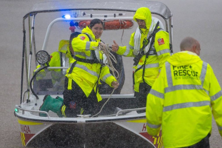 Floods plea after woman found dead in SUV