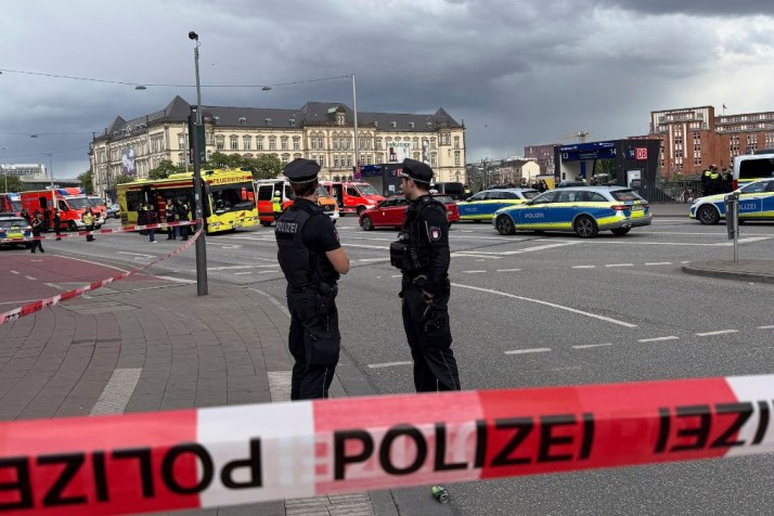 Woman arrested over knife rampage at train station