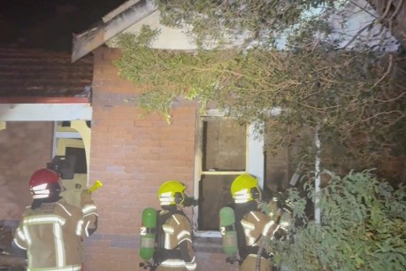 Man dead in house fire amid search for relative