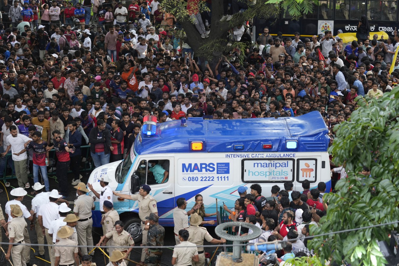 Thousands of cricket fans gathered outside the Chinnaswamy Stadium in Bengaluru city.