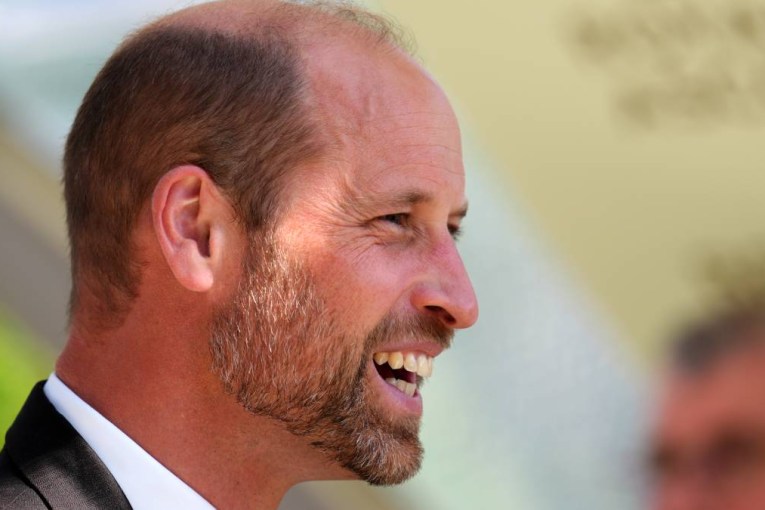 Snap of William with new additions to family marks big day