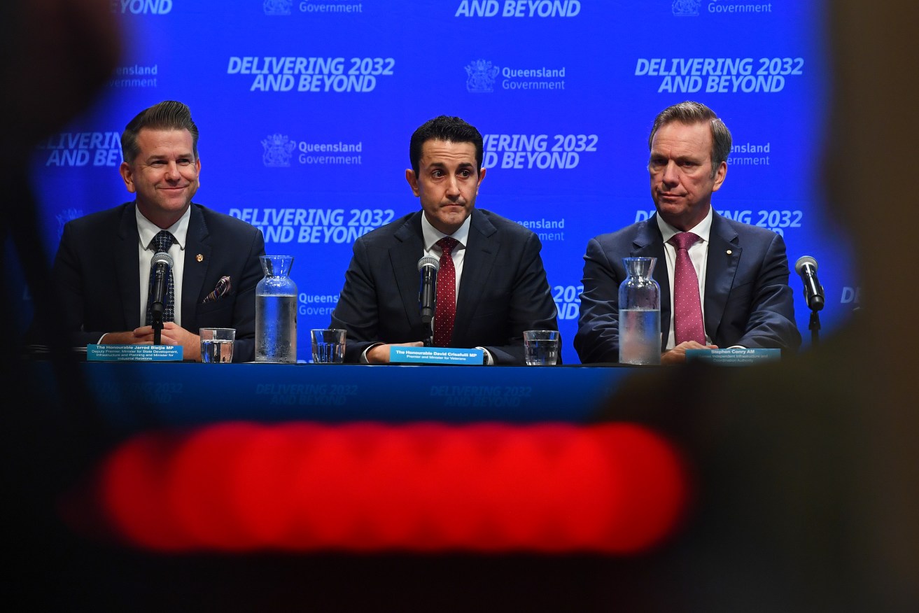 David Crisafulli's (centre) government has an eye on the Olympics as it hands down its first budget.
