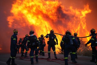 Greece arrests woman for fuelling fire with cigarette