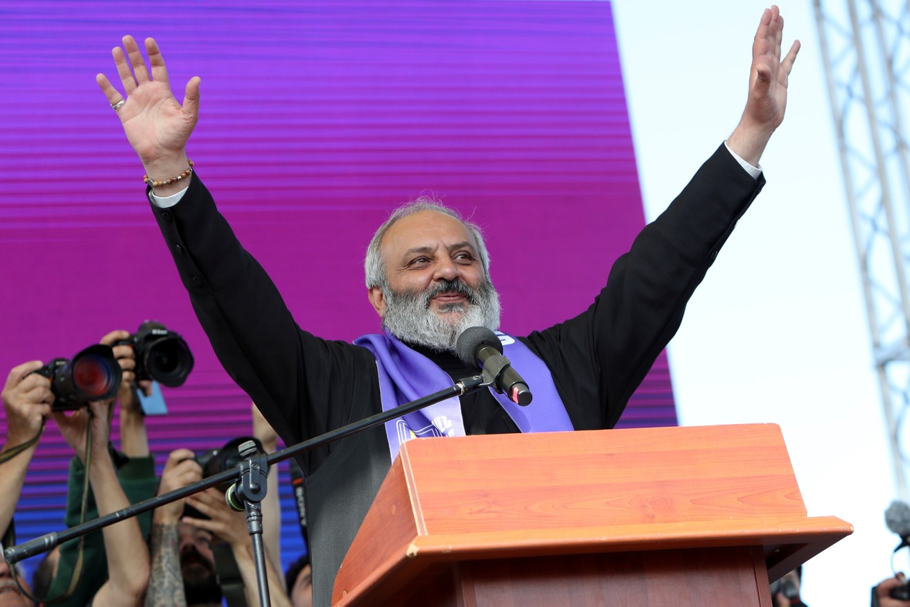 A prominent archbishop and 13 others have been accused of trying to seize power in Armenia.
