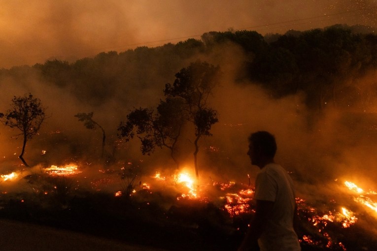 Thousands evacuated as fires threaten Greece, Crete