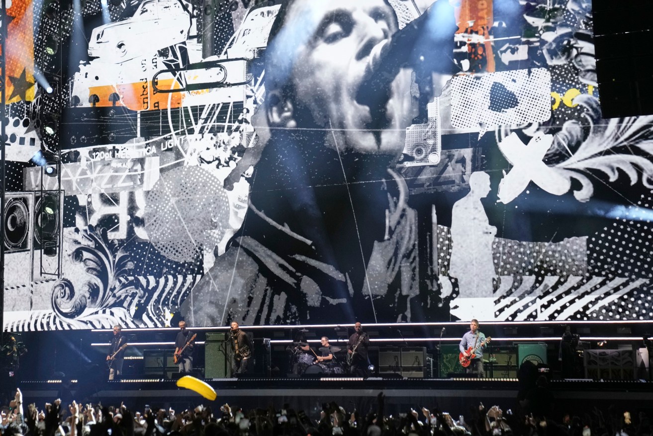 Oasis perform during their reunion concert in Cardiff.