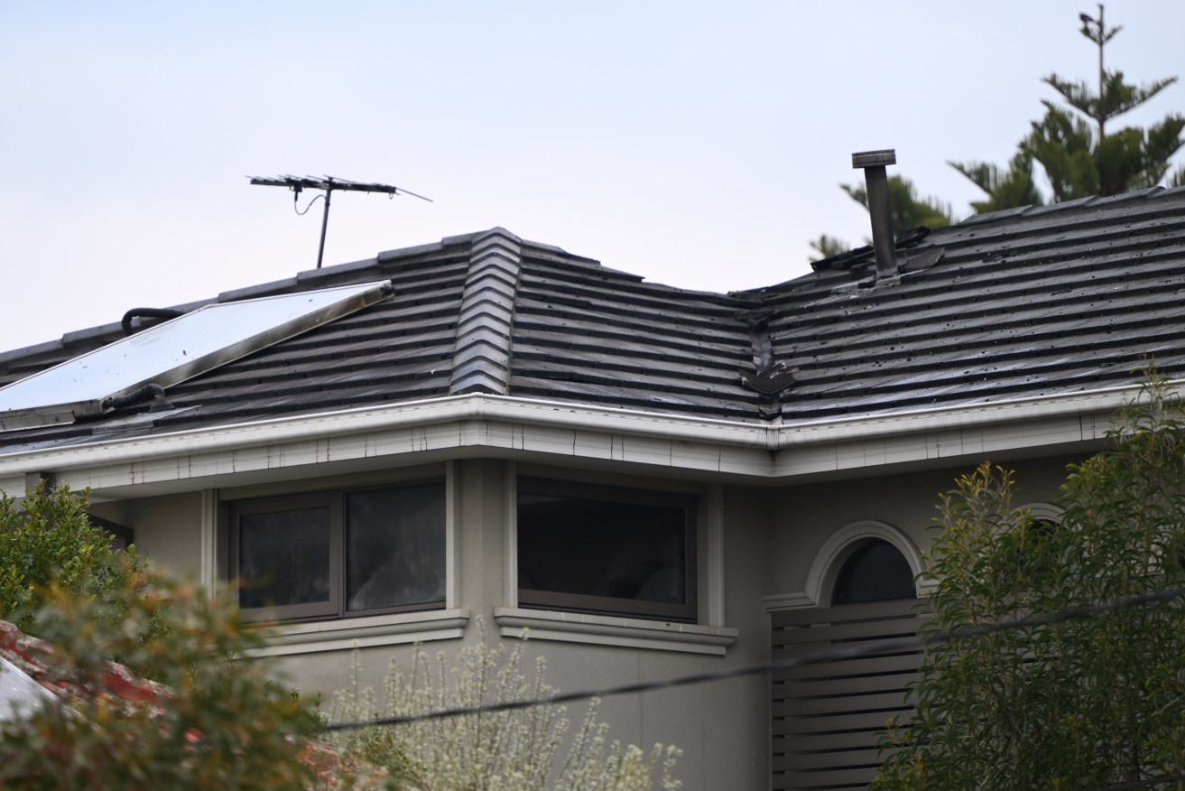 A woman has been charged with two counts of attempted murder after a house fire in May. 