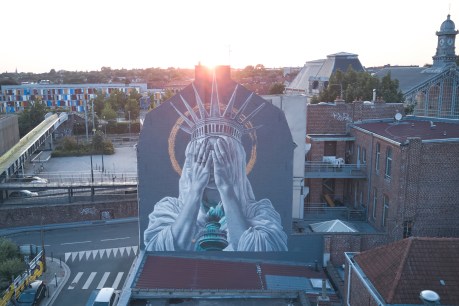 French mural of despairing Statue of Liberty polarises 