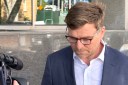 Former bank exec accused of grooming girls dies