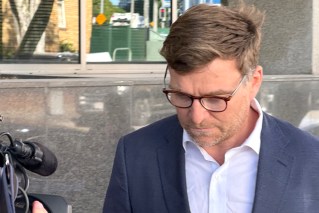 Former bank exec accused of grooming girls dies