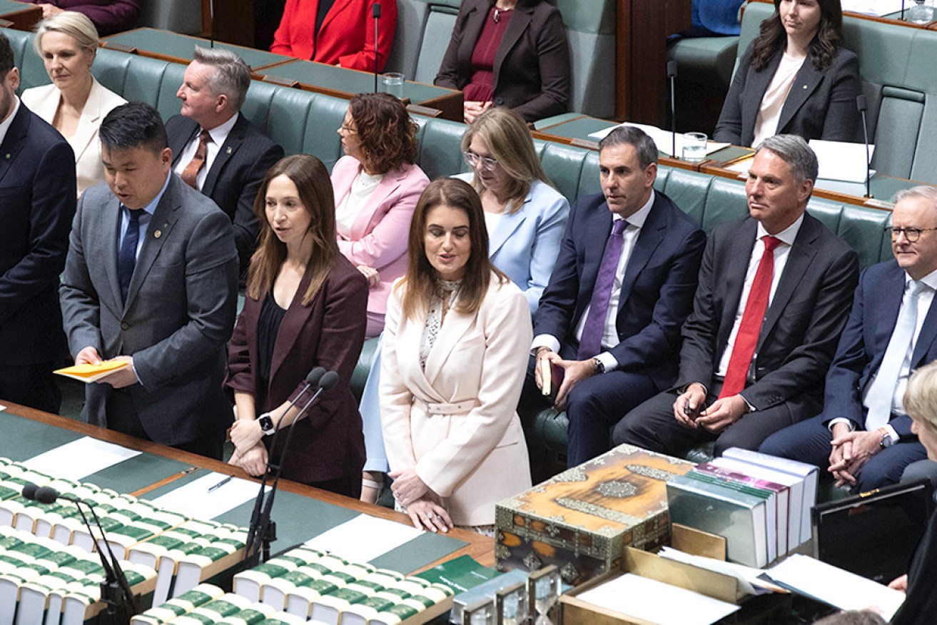 Ali France (front right in white) is sworn in on Tuesday.
