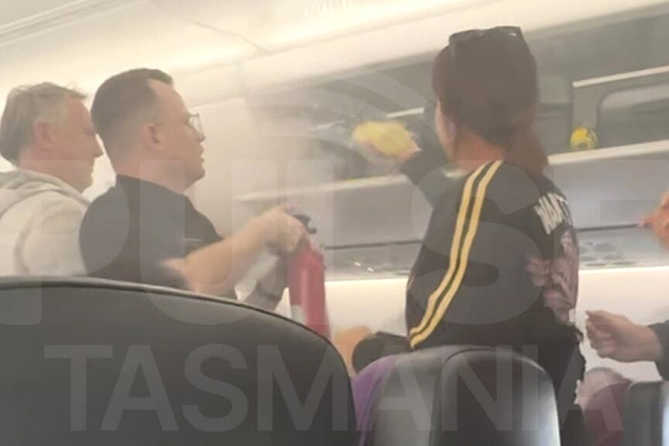 Smoke filled the cabin as passengers and crews tried to put out the fire.