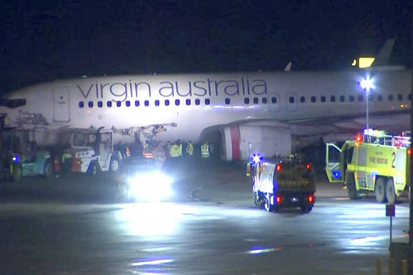 A large gash can be seen in the plane's side after the incident.
