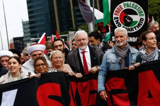 Australia pledges more aid after mass protest